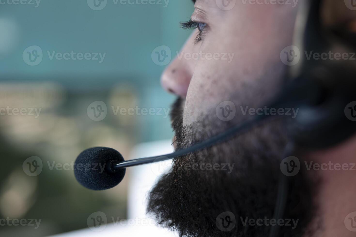 Professional army IT engineer reviews satellite imagery from CCTV radar system, using federal reconnaissance footage. Soldier with headset monitoring ongoing defense operation. Close up. photo