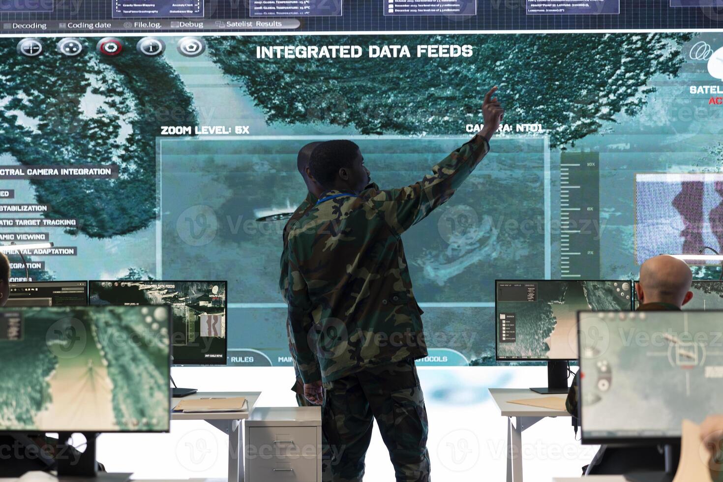 Infantry unit troopers examines satellite surveillance imagery for a mission before going into the battle. Skilled army soldiers receiving important battlefield information, training program. photo
