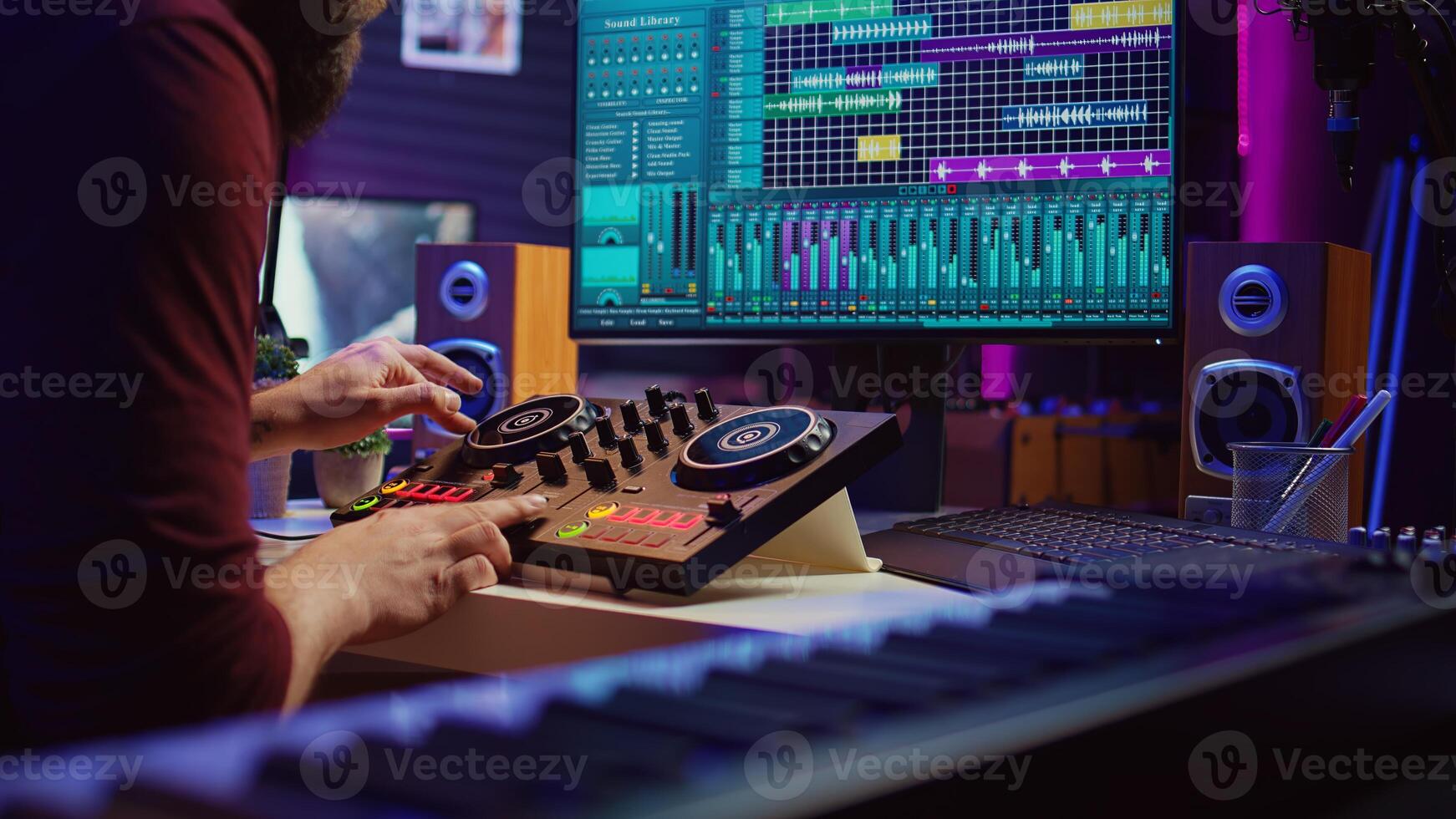 Audio engineer recording piano keyboard instrument notes and vocals, operating a mixing console with amplifier and daw software on computer. Artist editing sounds for music industry. Camera B. photo