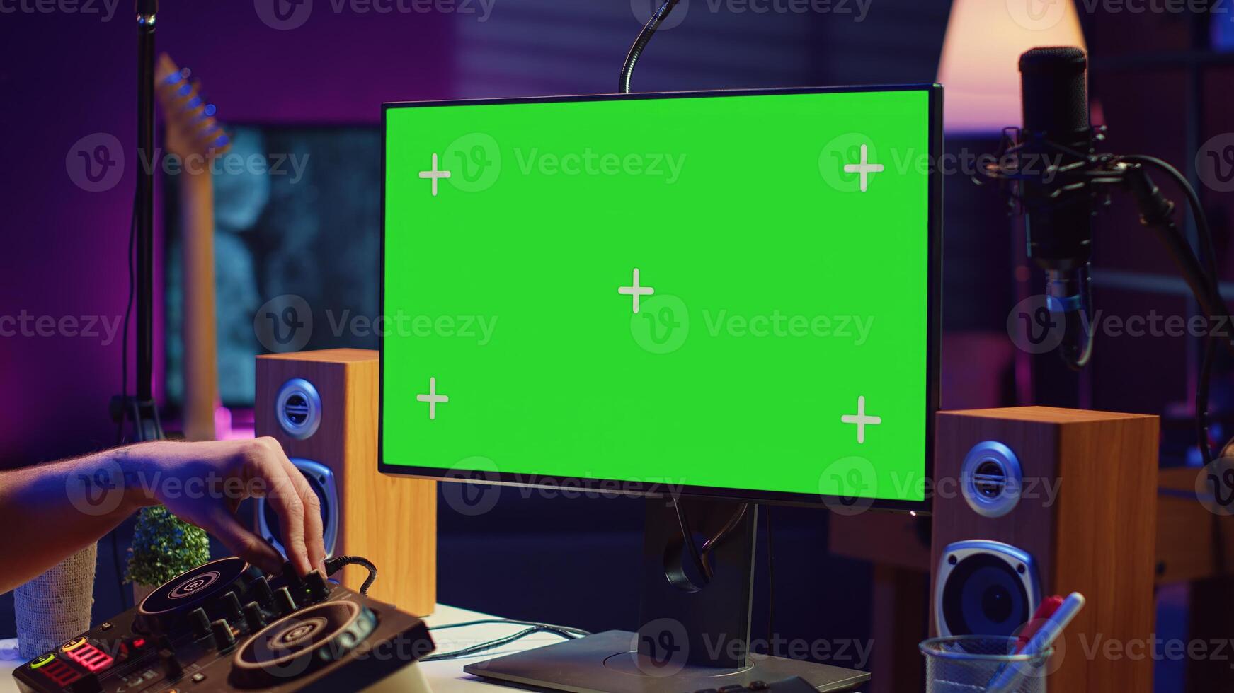 Music producer songwriter mixing piano key notes in home studio, operating with greenscreen monitor on pc. Artist producing sound effects and adjusting volume levels with electronic tools. Camera A. photo