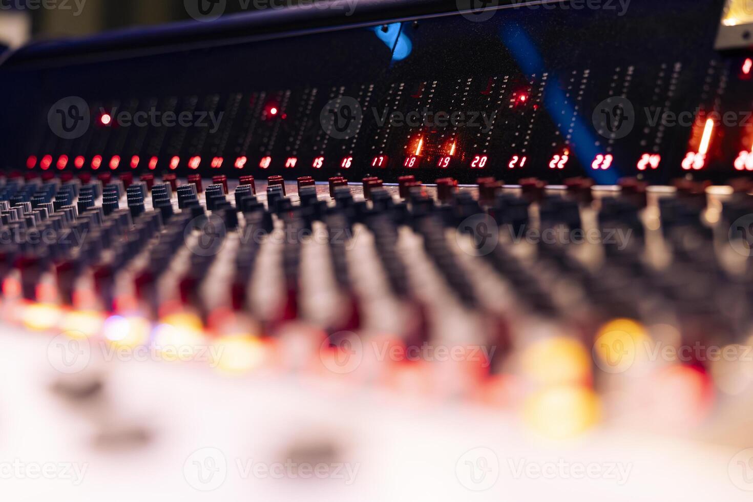 Pre amp knobs and buttons on mixing console panel board control desk, audio technical gear used in music post production. Modern tools and equipment in professional studio. Close up. photo