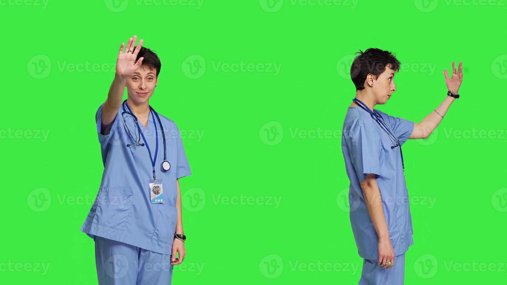 Medical assistant calling people over to come closer for examination, inviting patients at cabinet for checkup. Nurse with scrubs stands against greenscreen, come at me concept. Camera B. photo