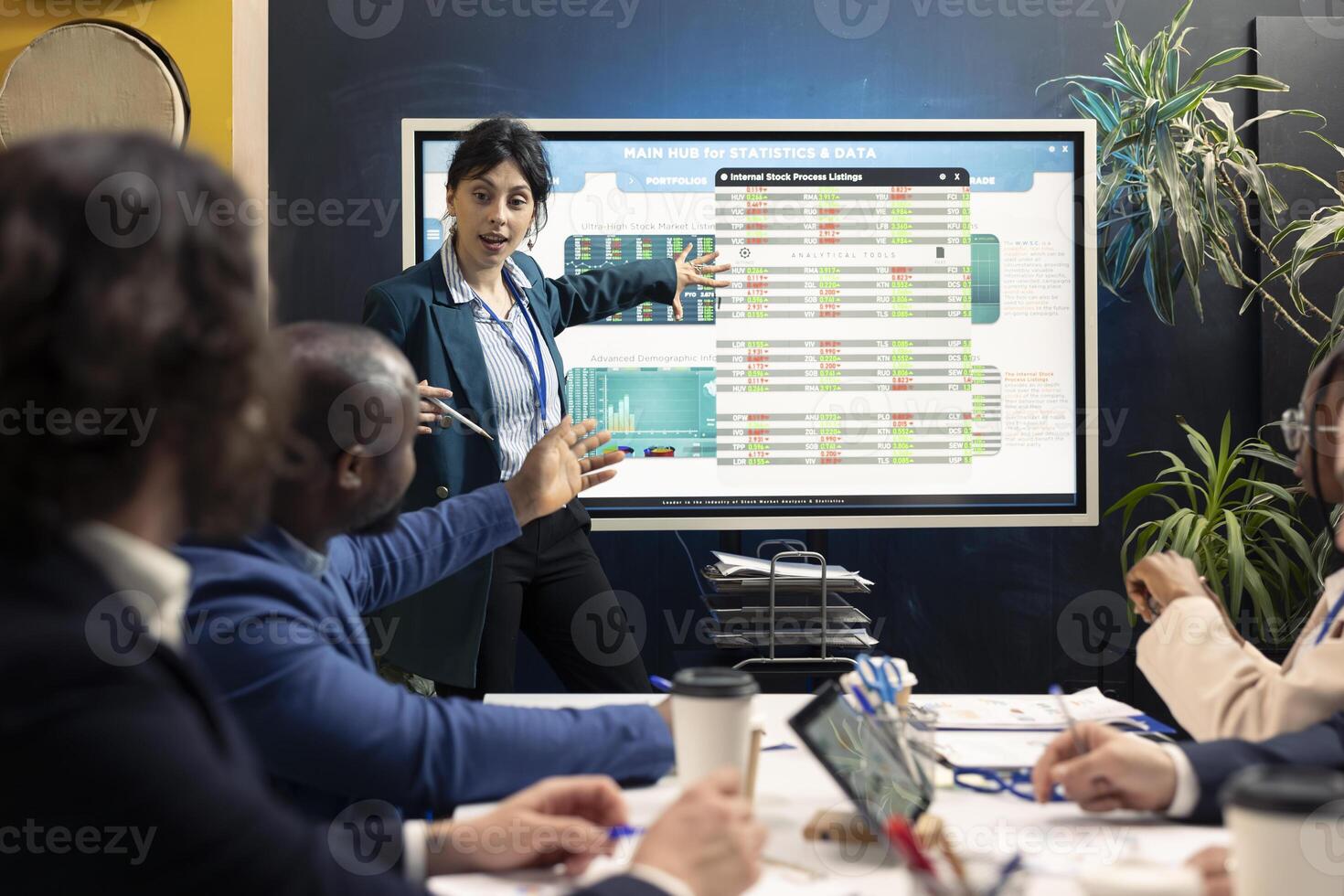 Business affiliates examining current budgeting plans on interactive board, organizing an executive meeting to share ideas about updates for success. Coworkers making decisions for a project. photo