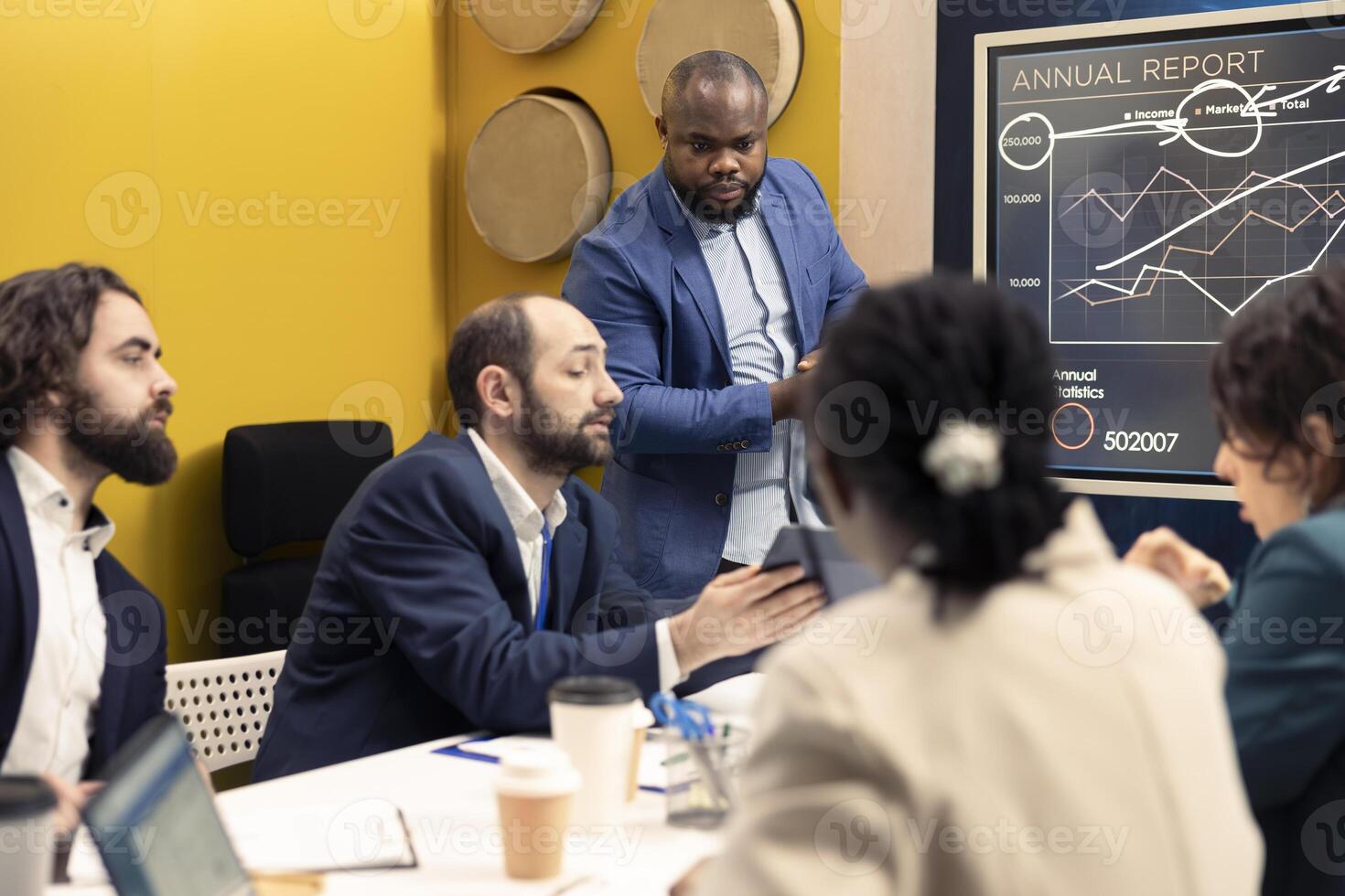 Team of company employees discussing agenda for upcoming projects, planning and coordinating resources to sustain organizational progress. Coworkers communicating updates and priorities. photo