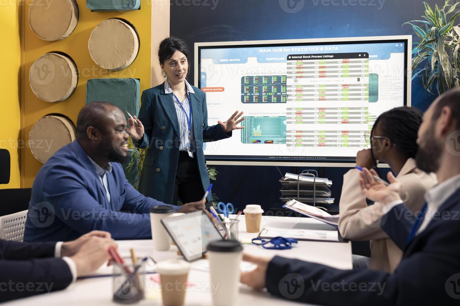 Business supervisor sharing opinions about a new project strategy with his team members, discussing plans for organizational expansion. Employees looking to increase company profit. photo