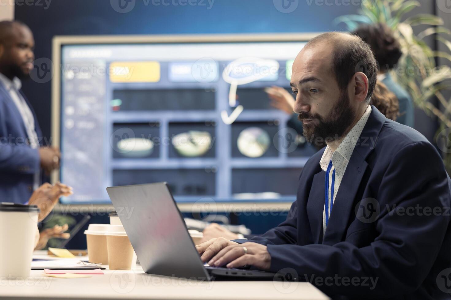 Stressed business manager working under pressure to meet deadlines, finish all important tasks and accomplishing the organization goals. Strained corporation meeting in a boardroom. photo