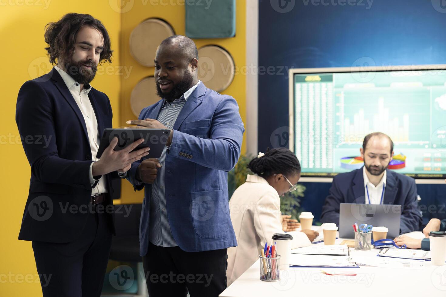 General director and CEO sharing insight about a new expansion strategy with their employees, presenting data reports an infographics to analyze business activity status. Coworkers in a meeting. photo