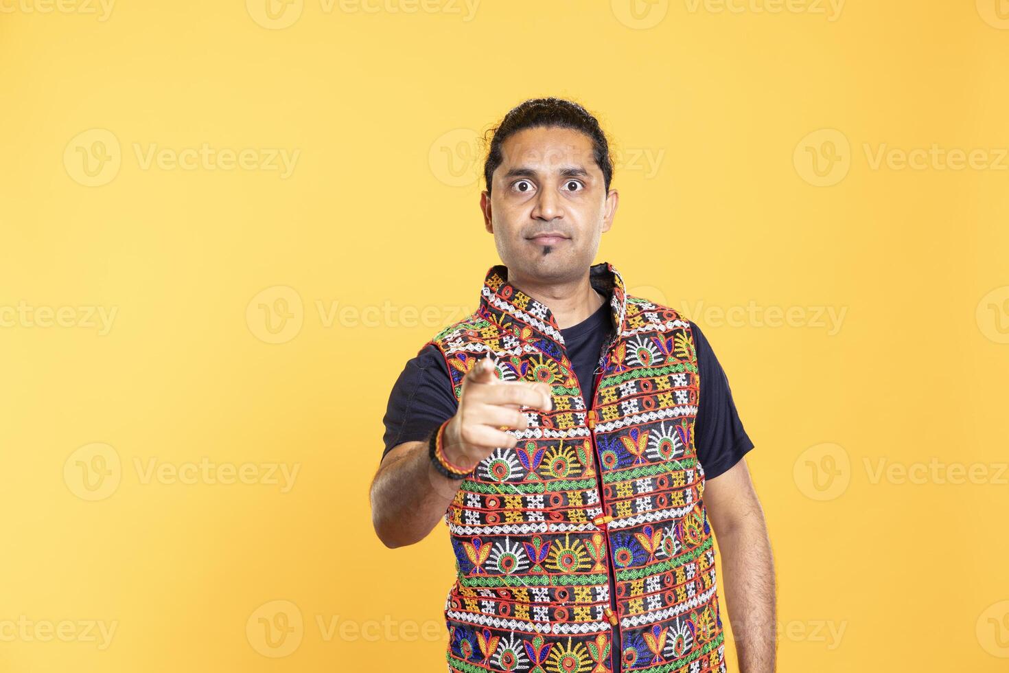 Disappointed man admonishing friend over debacle, isolated over studio background. Upset person in disagreement with mate, pointing finger and lecturing him after altercation photo