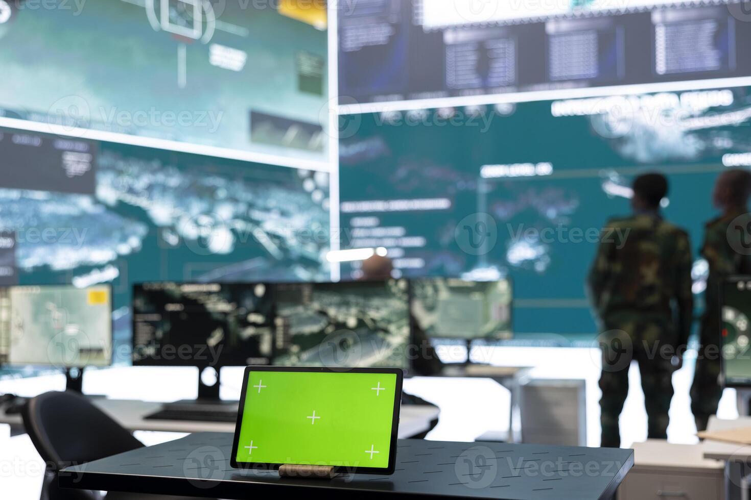Laptop showing isolated chroma key screen in army monitoring room, military staff working on gathering real time information for a new operation. General headquarters with high tech gear. photo