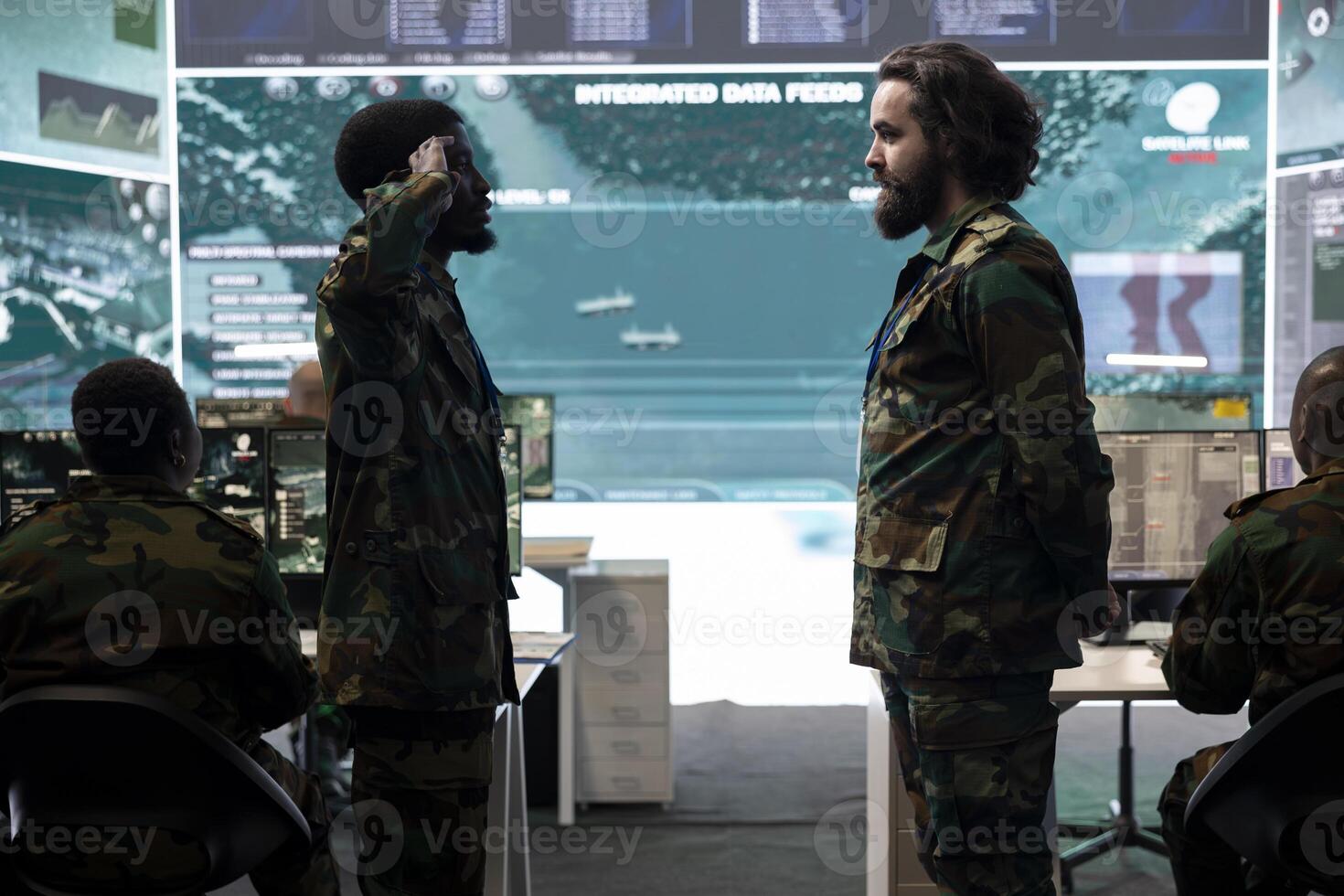 Standing at attention, the trooper executes the military salute symbol to offer his respect and devotion to his superior. Patriot army conscript saluting the captain in federal command center. photo