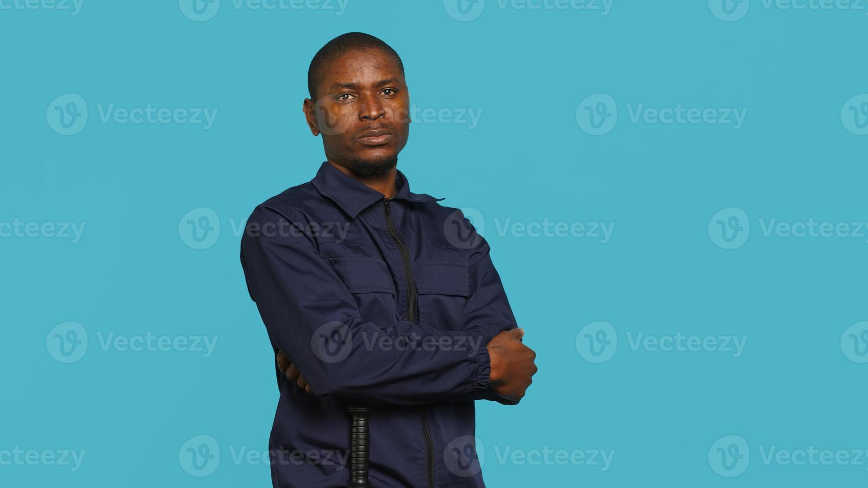 Security guard doing salute hand gesture, preparing to start job of deterring criminals. Portrait of bodyguard doing greeting gesturing and military pose, studio background, camera A photo
