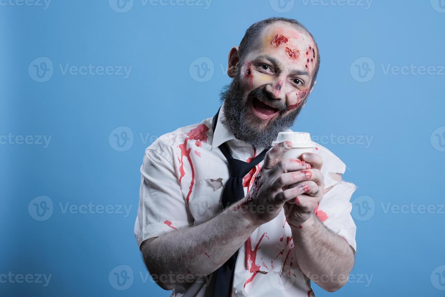 Junkie laughing like maniac after finally drinking coffee and getting