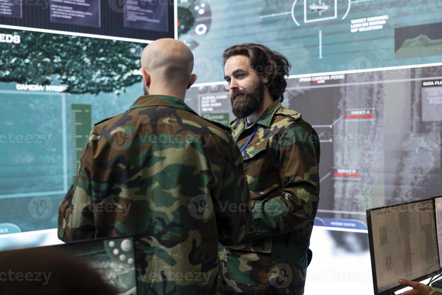 Reconnaissance department specialists gathering information for a national safety mission, transmitting intelligence to the infantry unit. Telecommunications staff in army command center. photo