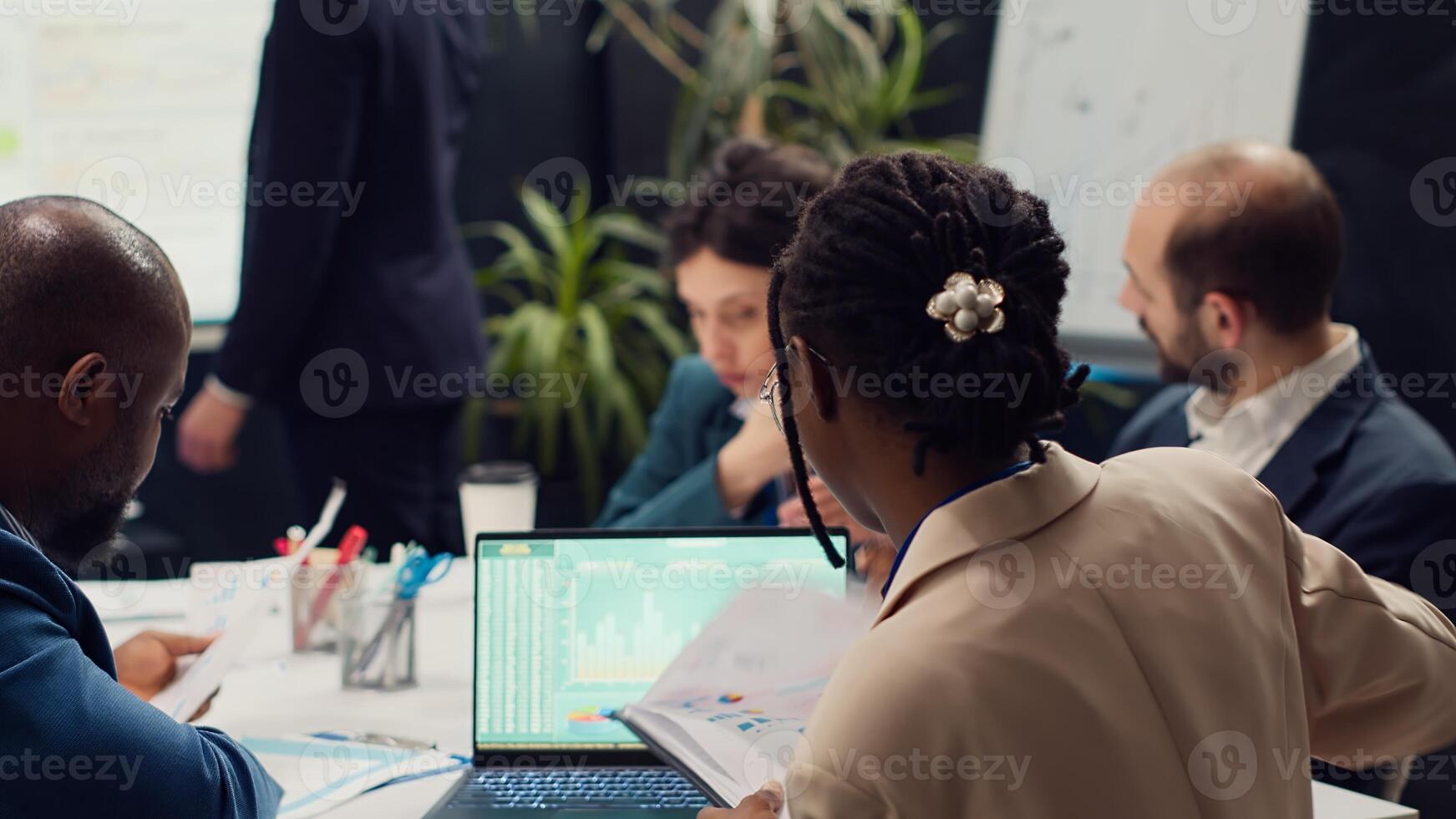 Diverse team of specialists developing corporate communications strategies, working together to ensure goals and achievements. Manager and employees collaborating on new project. Camera A. photo