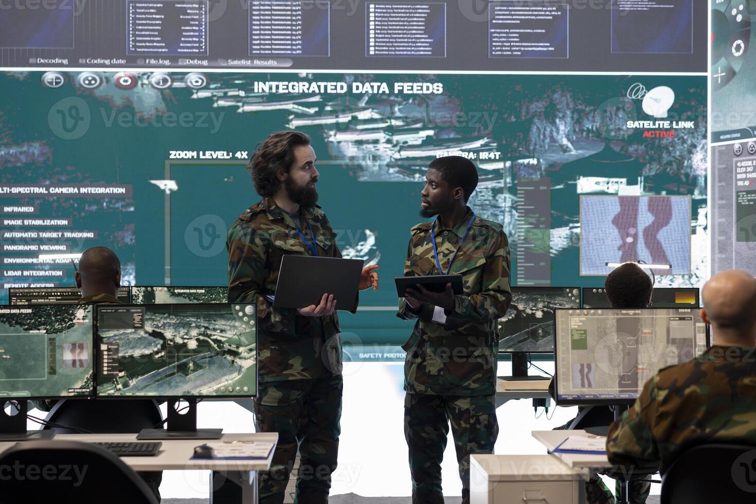 Military personnel team conducting briefs to update the servicemen on mission status and objectives, employing federal satellite system for reconnaissance from an army power base of operations. photo