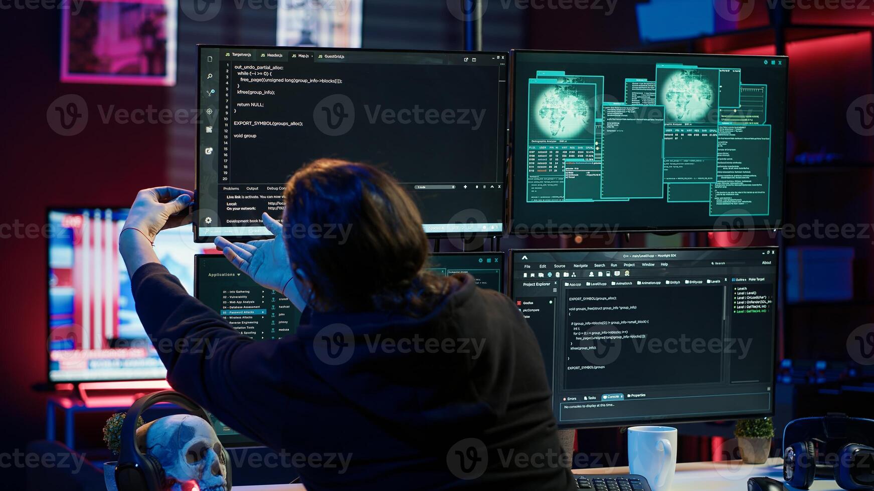Dangerous hacker writing lines of code on PC from secret apartment, trying to get past security systems. Evil software developer building scripts that can hack devices, camera A photo