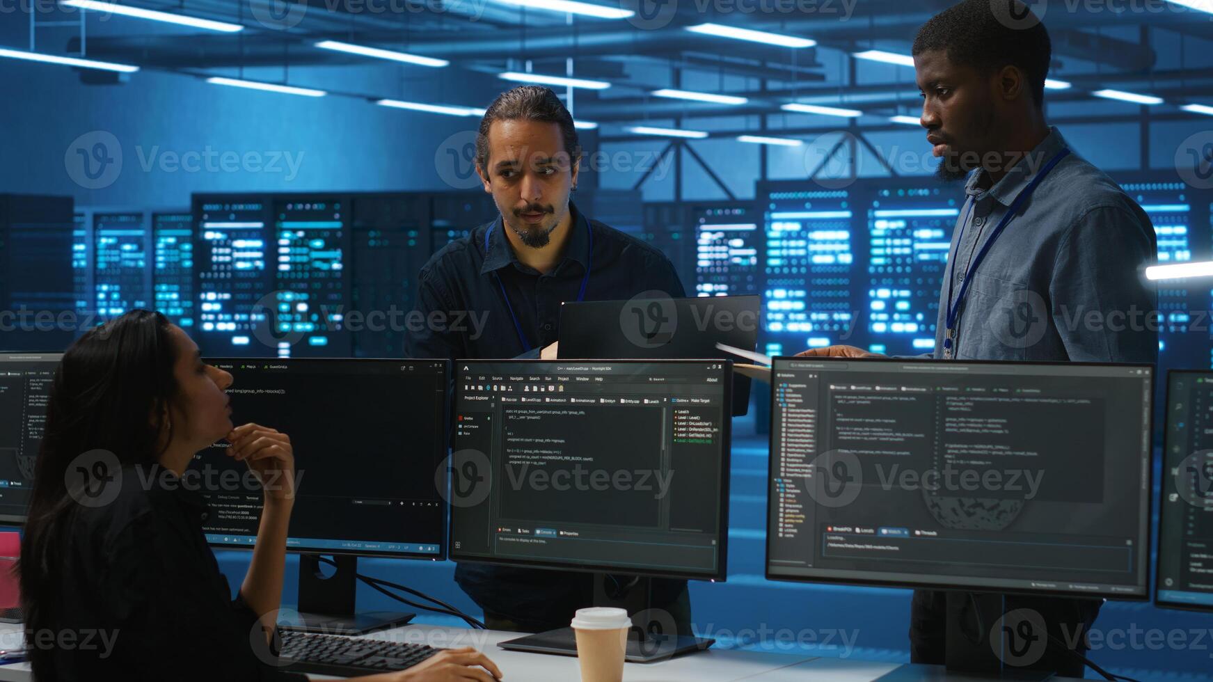 Man inspecting server farm, reading paperwork, following inspection checklist, talking with employees. Supervisor doing checkup in data center workplace, verifying reports files photo