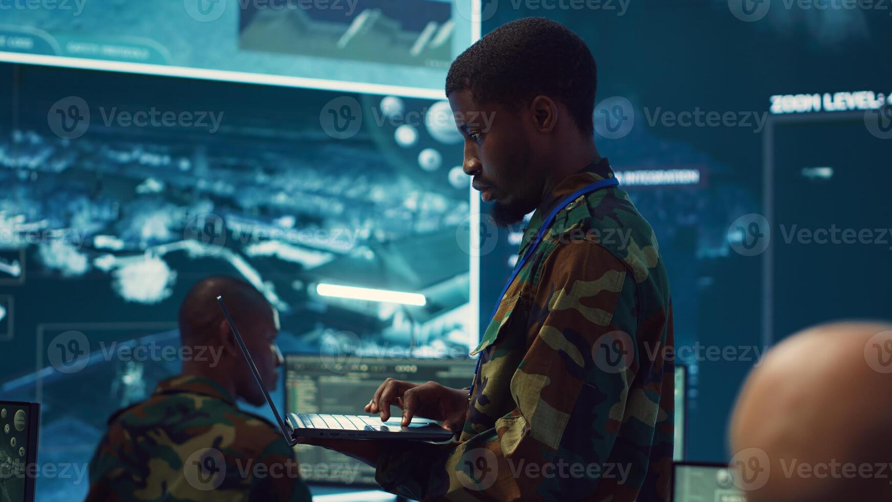 Military sergeant targeting enemy vessels on a gps satellite world map, operating from army power base monitoring room. Officer studies defense tactics on a tablet, command center. Camera A. photo