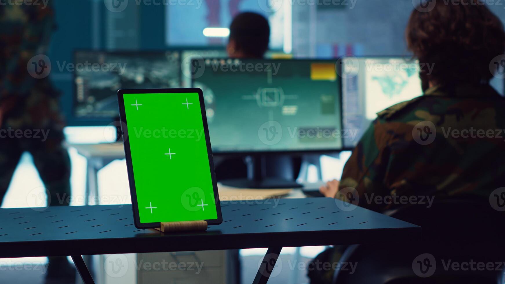 Isolated greenscreen display running on a tablet in military power base, soldiers follow surveillance footage to stay alert in case of a hostile attack. Satellite system for reconnaissance. Camera A. photo