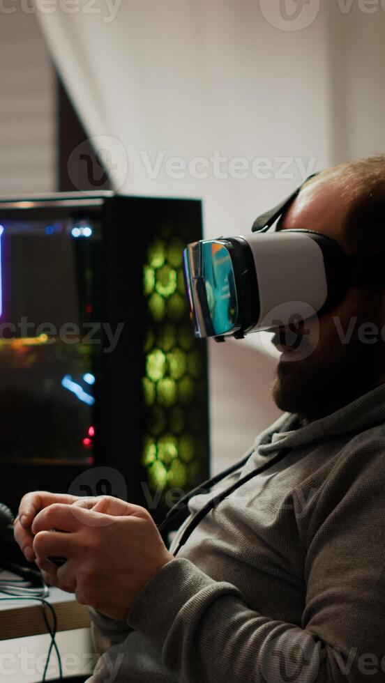 Pro cyber sport gamer wining playing games using vr headset. Virtual space shooter game championship in cyberspace, esports player performing on powerful computer during gaming tournament photo