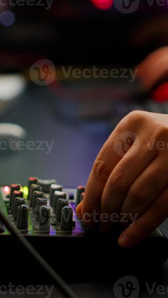 Close up of professional keyboard with RGB lighting streaming at chat. Player using powerful gaming computer in home studio of esport game typing at keypad playing space shooter videogame. photo