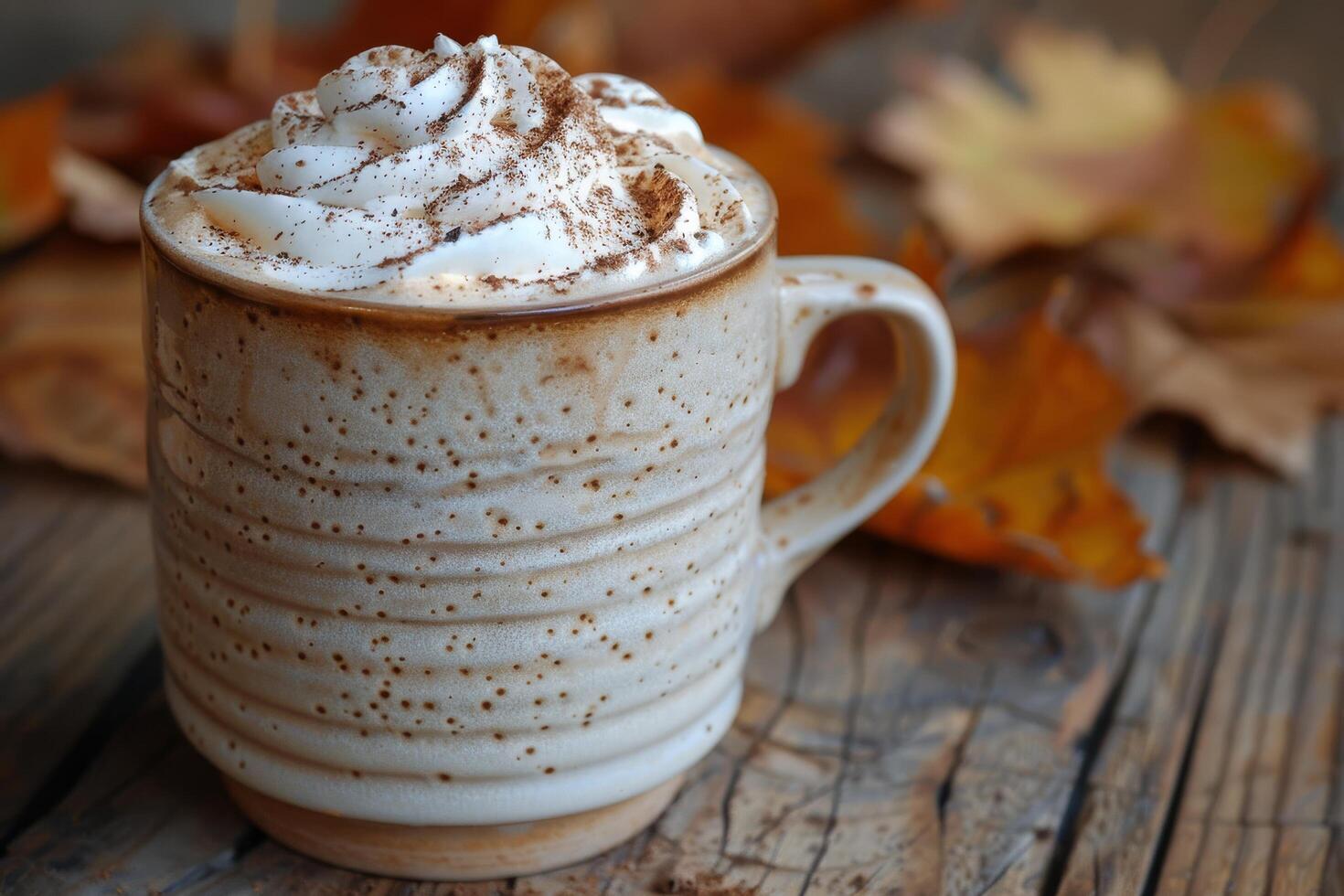 Whipped Cream Topped Pumpkin Spice Latte With Fall Decor photo