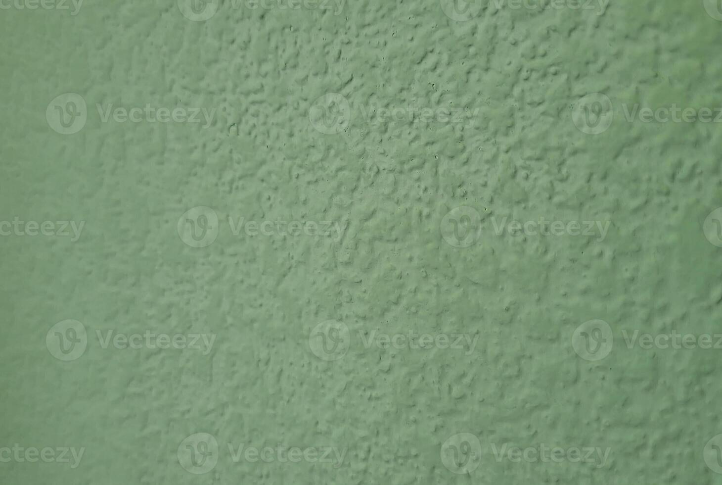 A simple background of an empty light green wall. photo