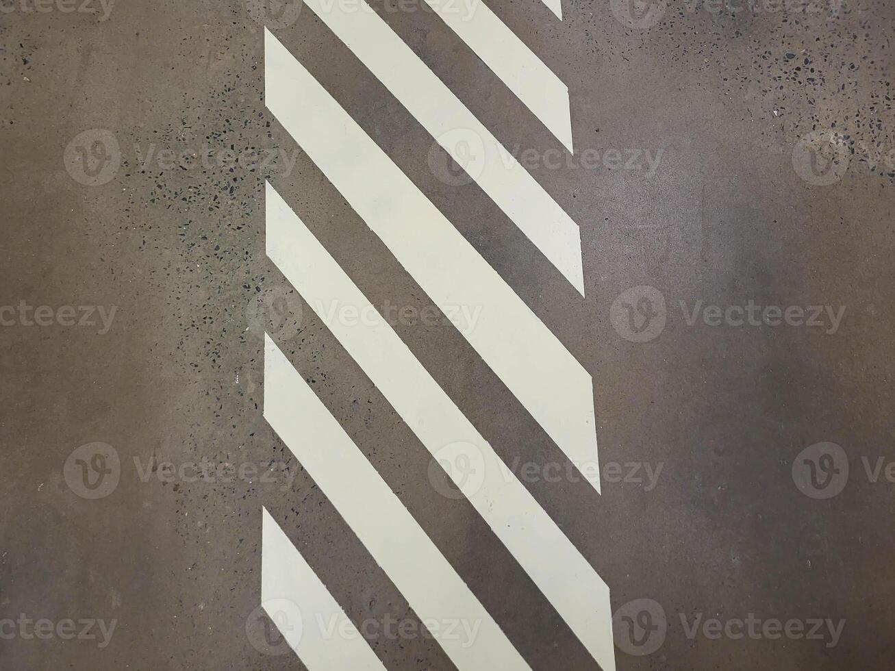 The store has a concrete grey floor with white markings photo