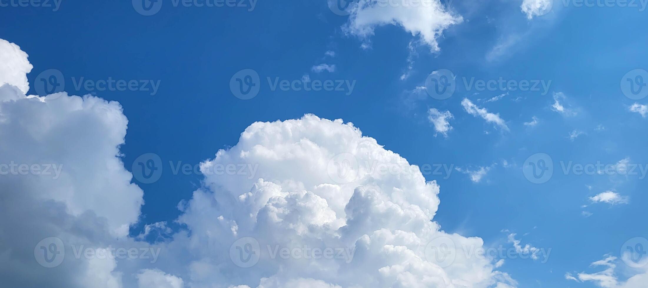 Cloudscape - Blue sky and white clouds, wide panorama photo