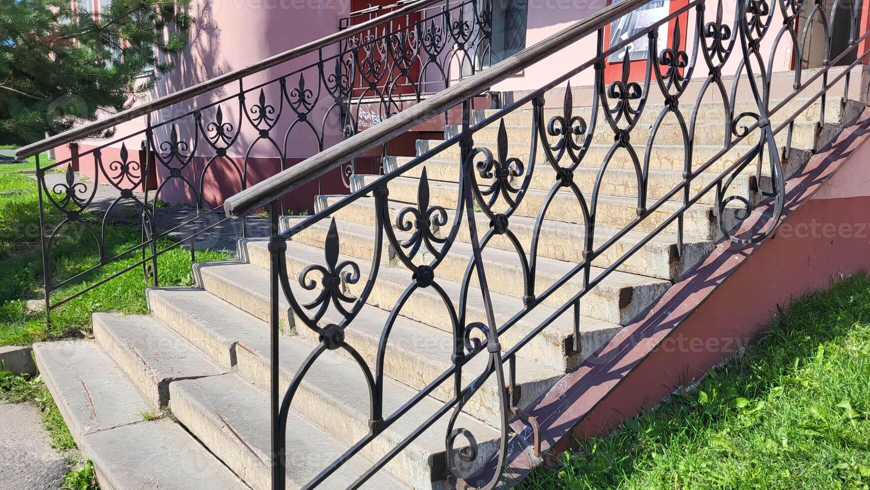 High porch with decorative wrought iron railings photo