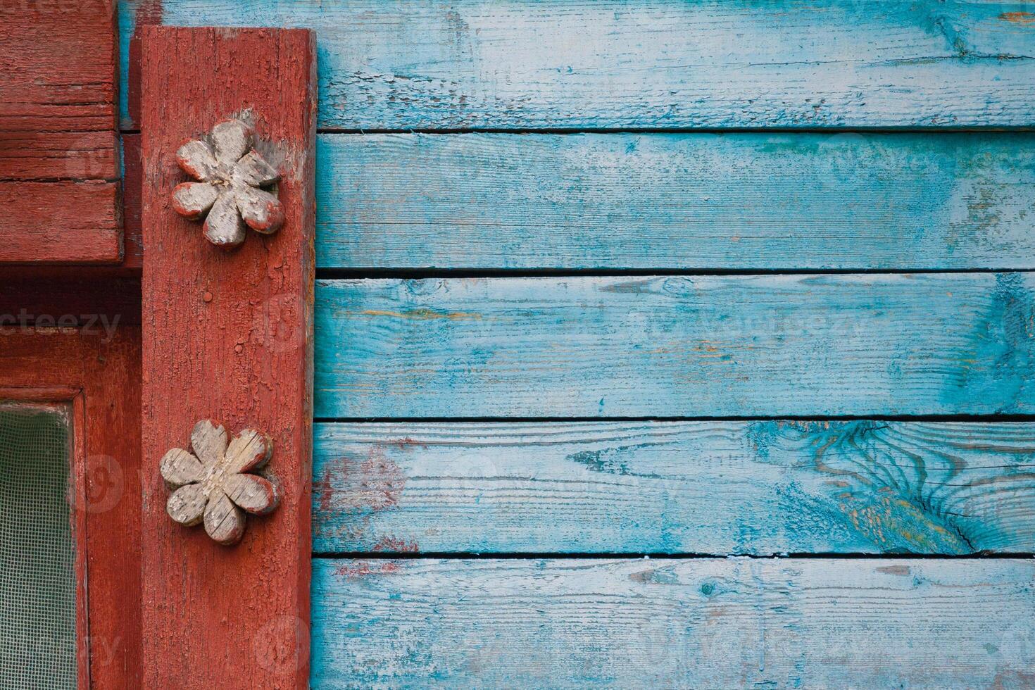 fragment of carved wooden window frame with patterns photo