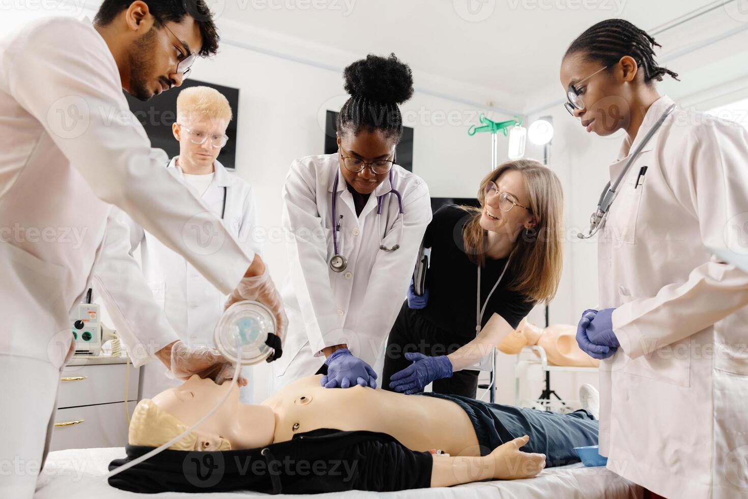 Medical Students Practice CPR on a Dummy photo