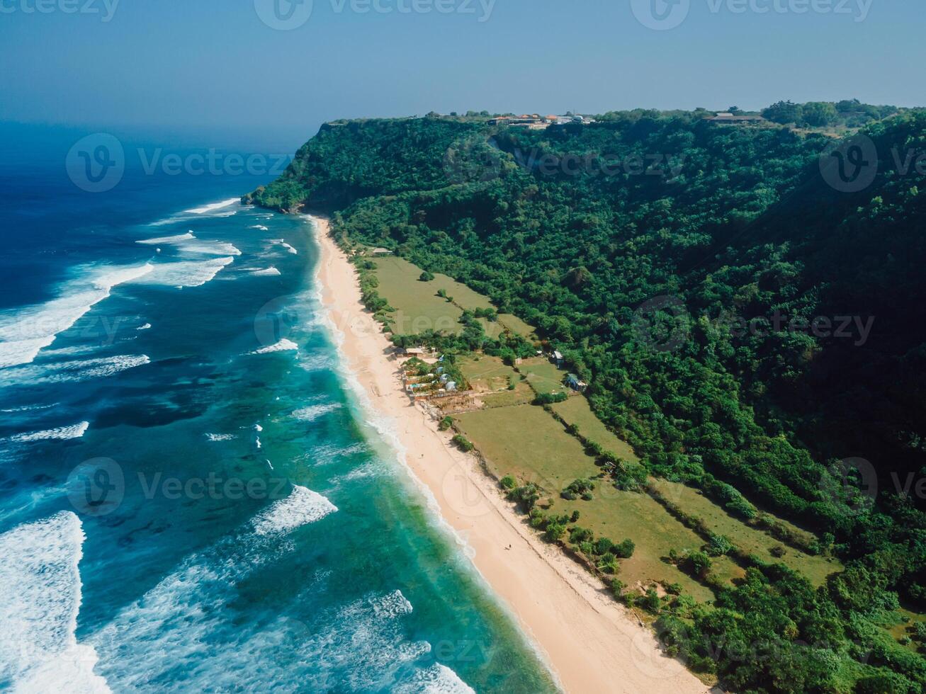 Aerial view of scenic coastline ocean waves and wild beach in Southern Bali island. photo