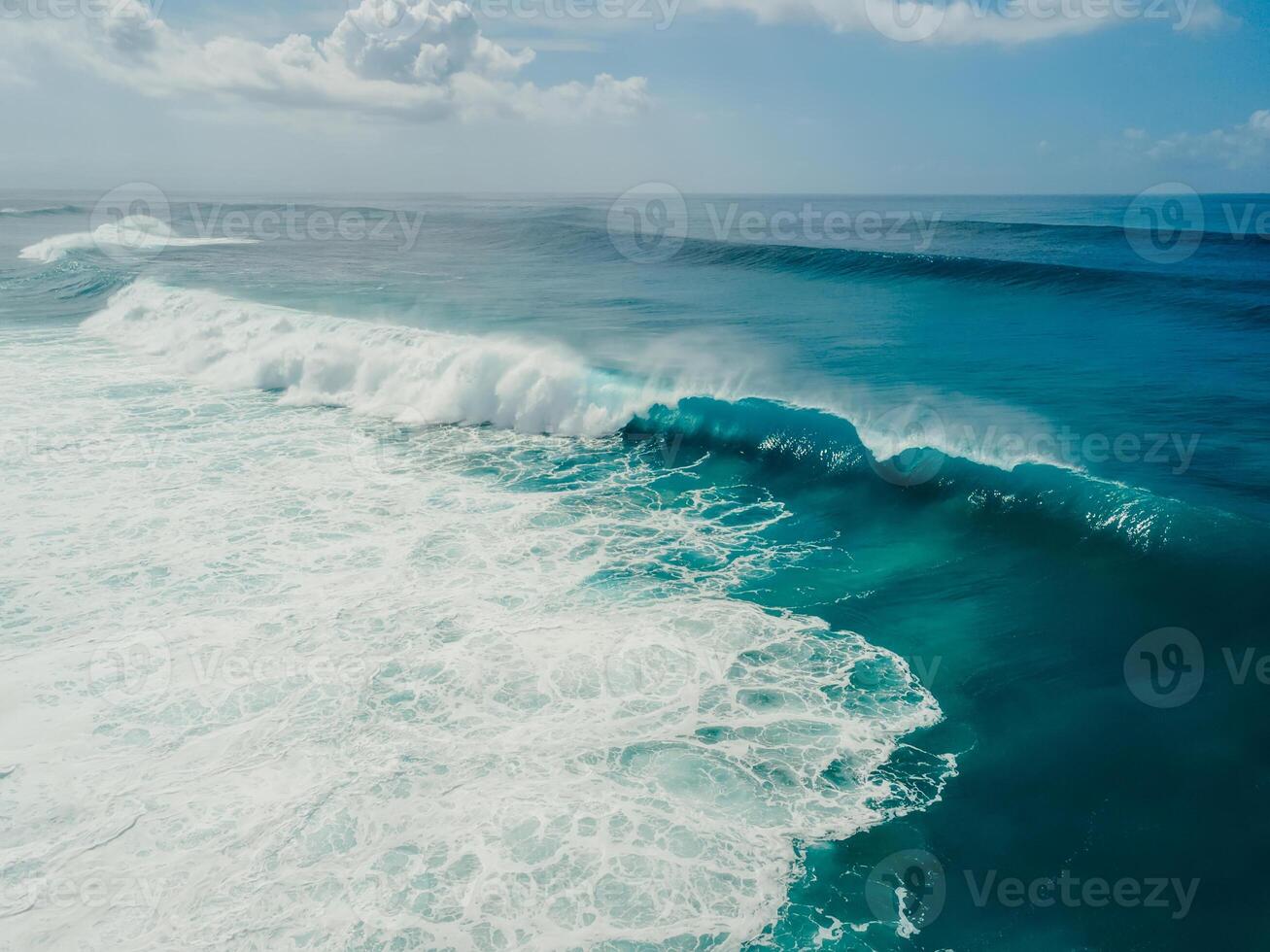 Barrel wave in ocean. Drone view of surfing swell waves photo