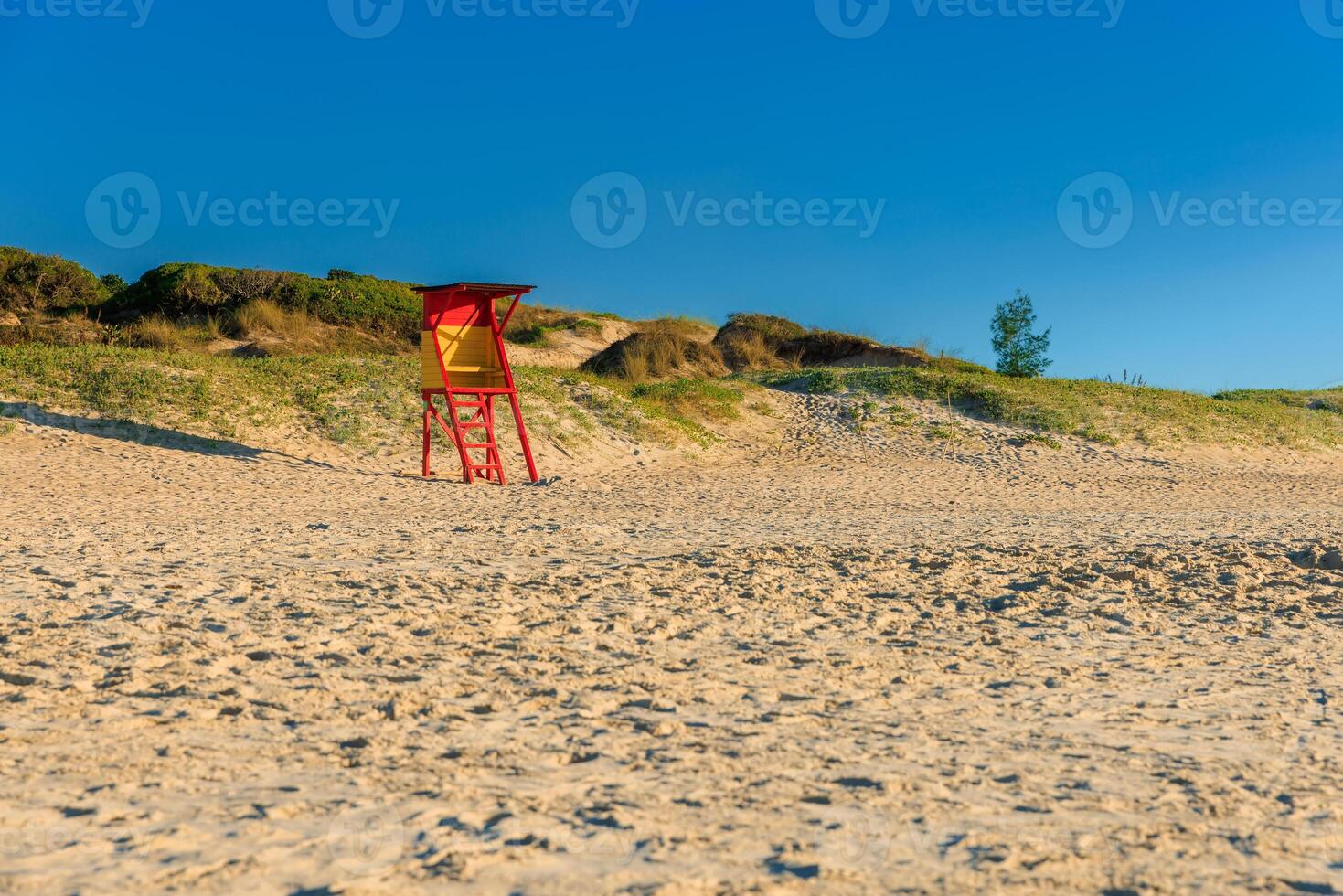 Beach with rescue tower and sun. Holiday beach in Brazil photo