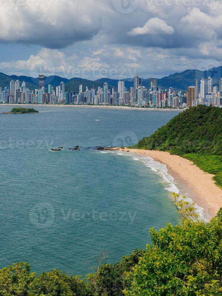 Balneario Camboriu city in Brazil and sandy beach with sea photo