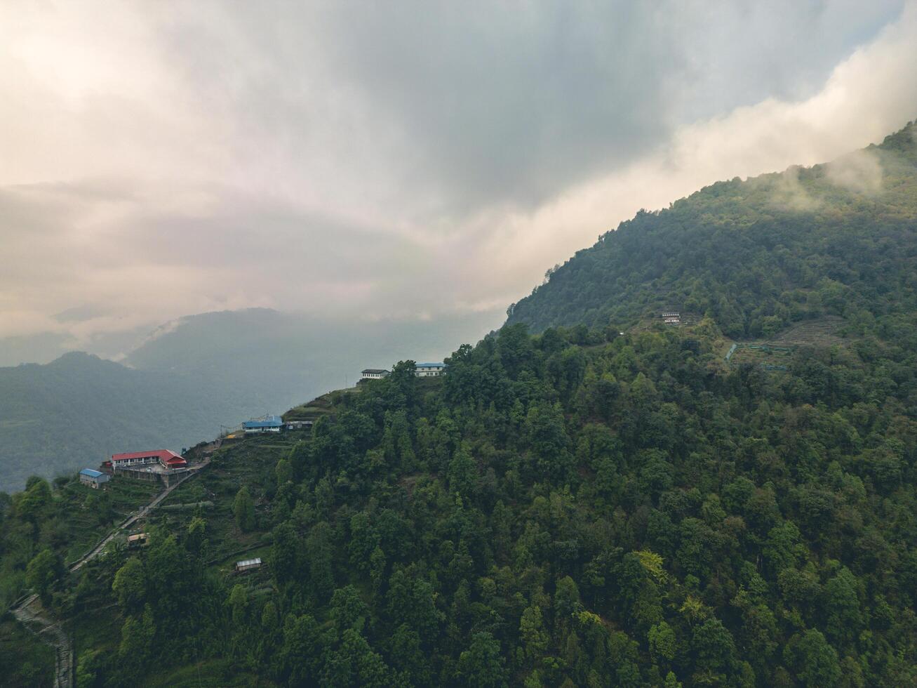 clouds over the mountains, mountains in the fog, during annapurna base camp, ghandruk, nepal photo