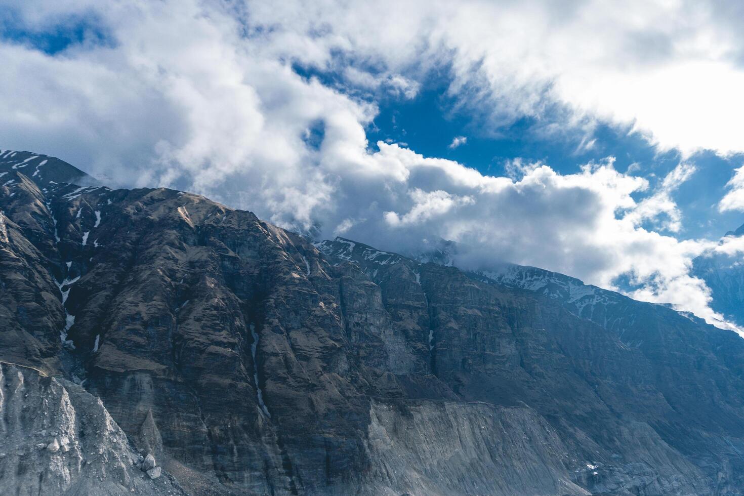 clouds over the mountains, mountains and clouds, snow covered mountain peaks, Mountain in nepal, mount everest country, Annapurna Base Camp photo