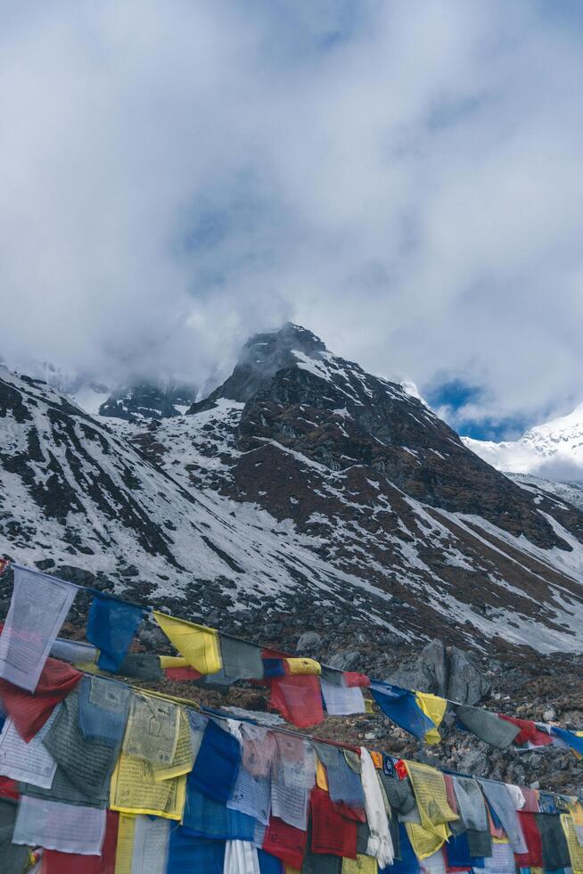 tibetan prayer flags in the mountains in nepal, Mountain in nepal, mount everest country, flags of the mountain in nepal photo
