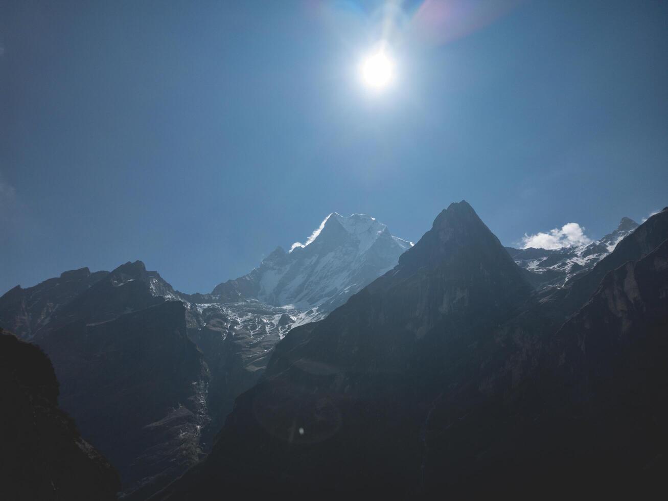 clouds over the mountains, mountains in the fog, during annapurna base camp, ghandruk, nepal photo