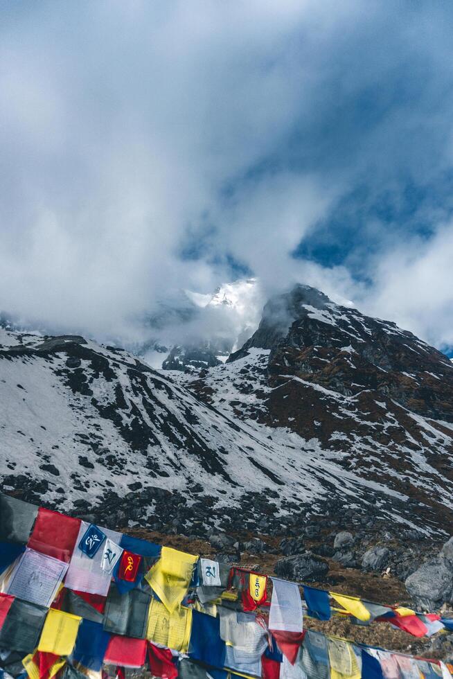 tibetan prayer flags in the mountains in nepal, Mountain in nepal, mount everest country, flags of the mountain in nepal photo