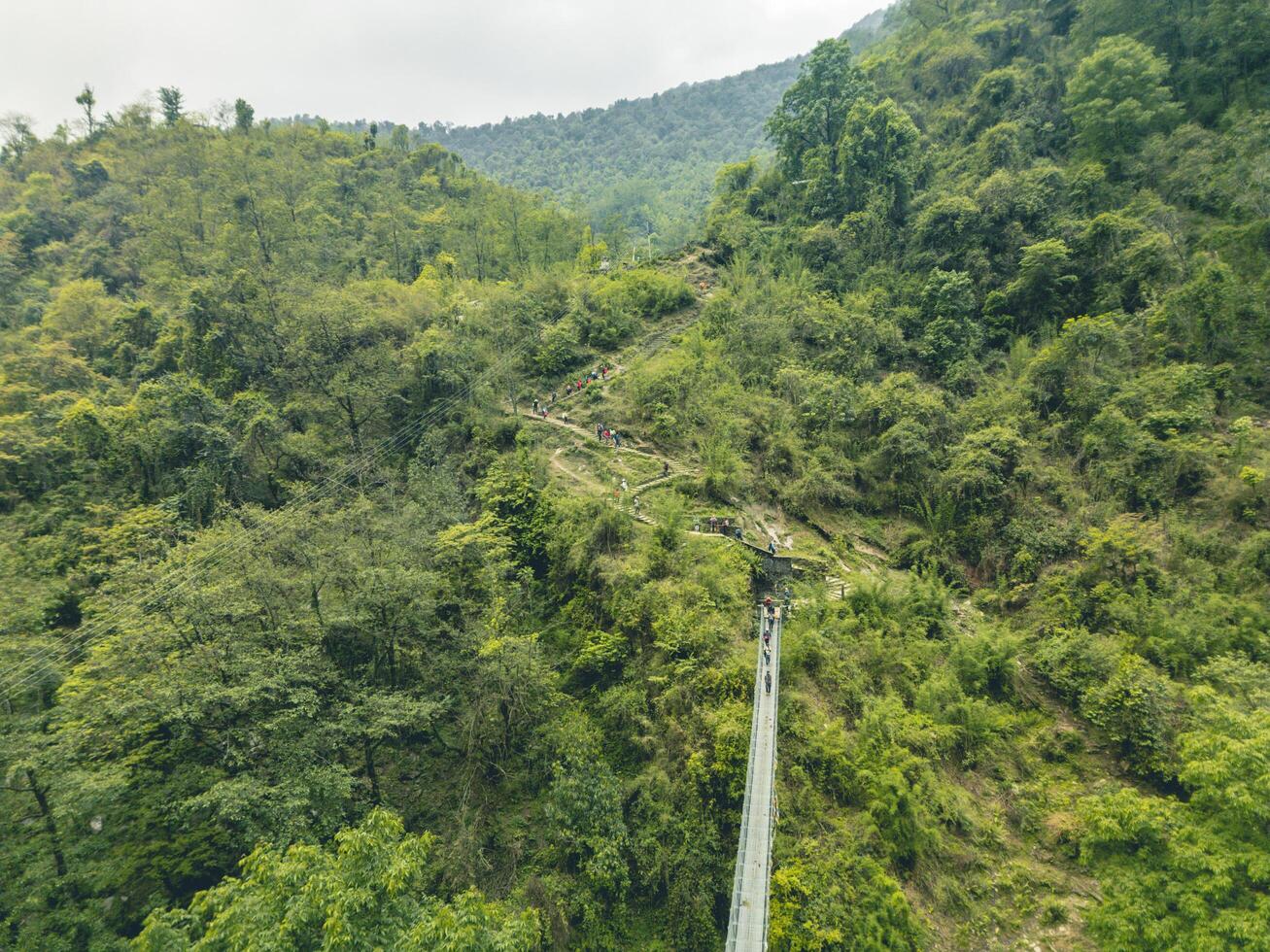 suspension bridge over the river, bridge over the mountain river, suspension bridge in ABC nepal photo