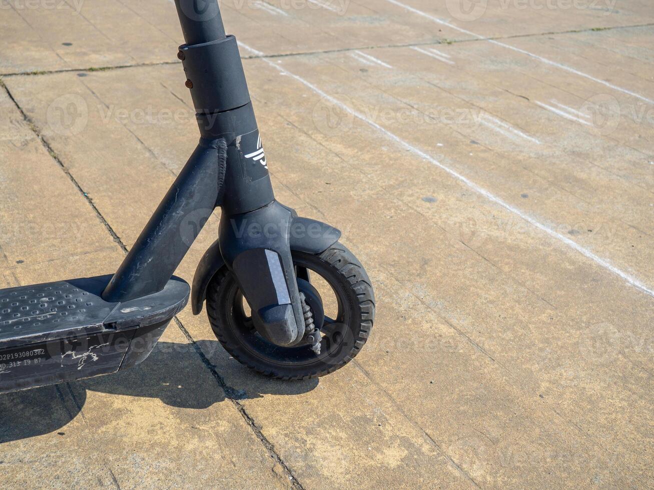 Electric scooter wheel. Used scooter. Leisure. Two-wheeled transport. Mechanics . photo