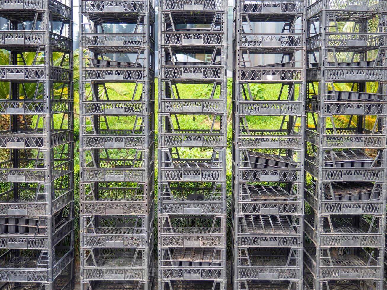 Stacked boxes on top of each other. Seedling boxes. Empty containers photo