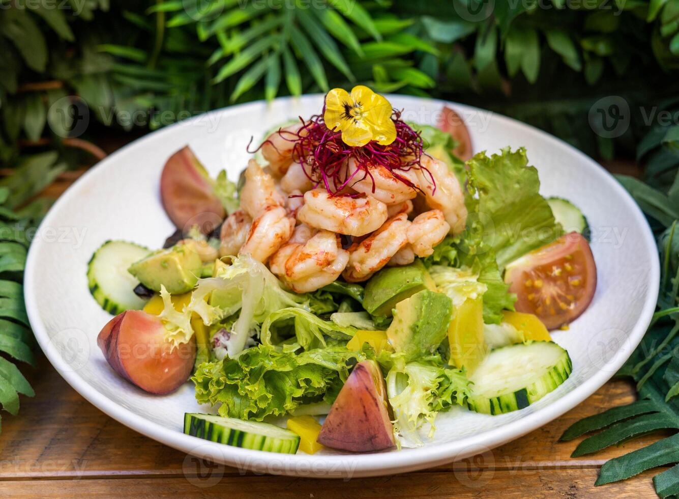 Gourmet shrimp salad and different green sprouts photo