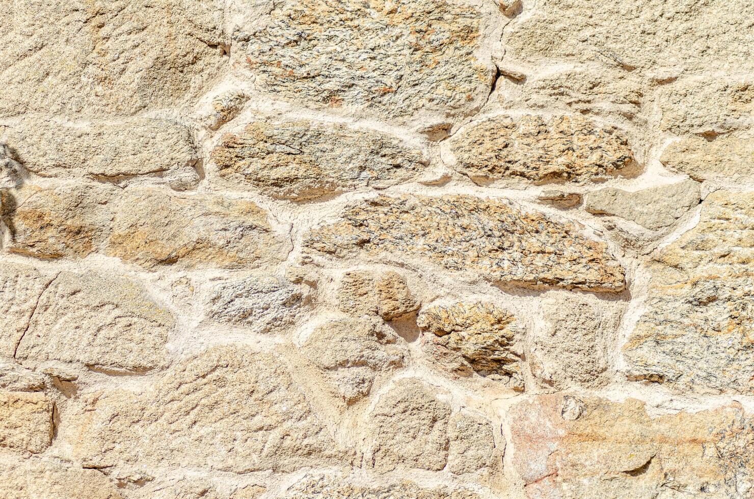 granite stone wall background, natural stone granite wall. Seamless texture. photo