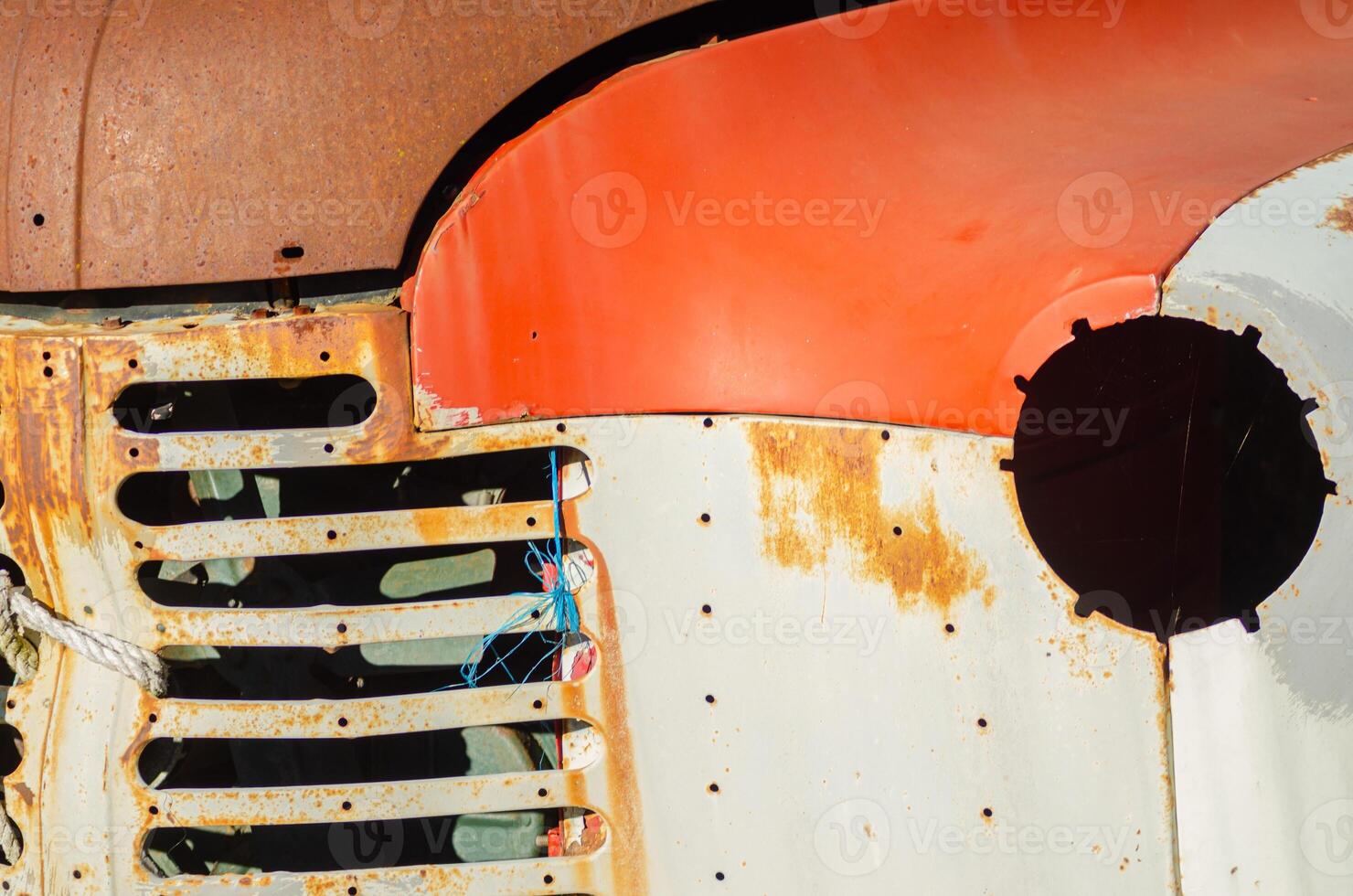 detail of the front part of an old retro car in a scrapyard photo