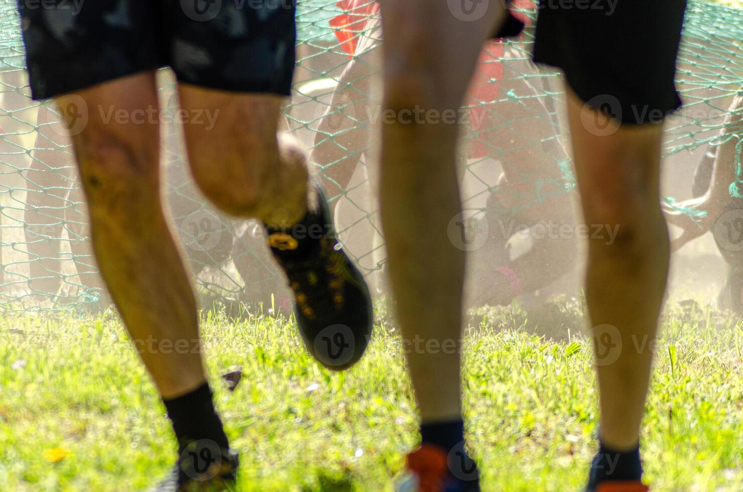 selective focus, athletes participating in obstacle course, OCR competition photo