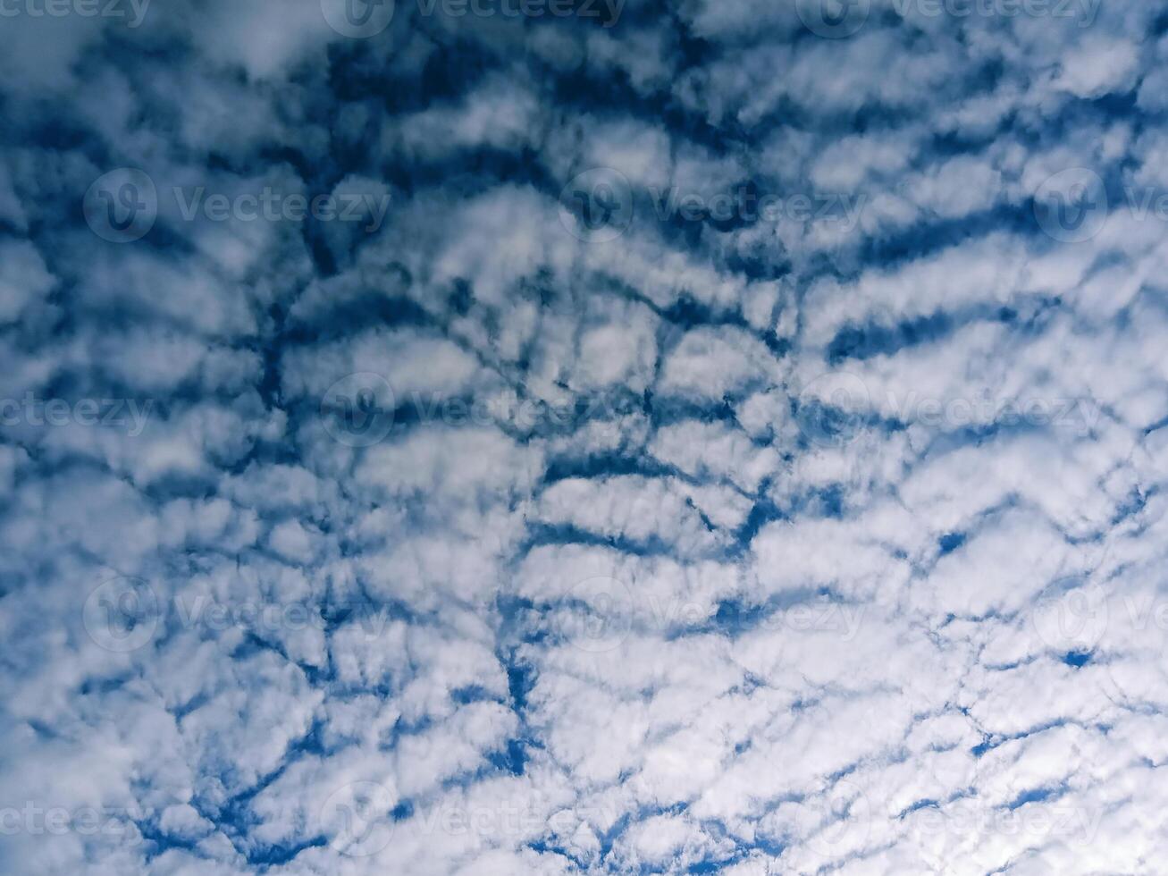 Horizontal shot of clouds on blue sky photo