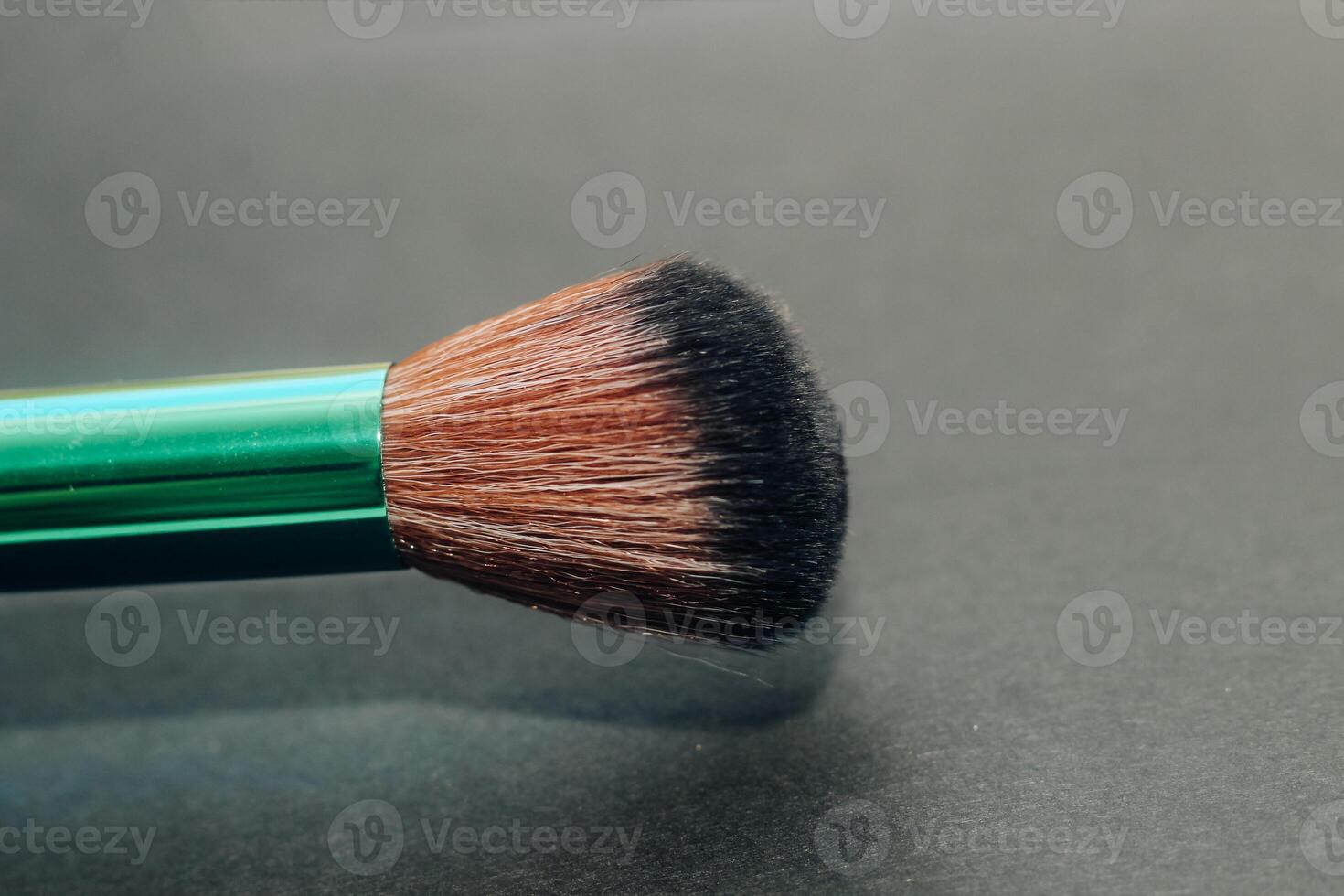 Green make-up bones on a dark background photo